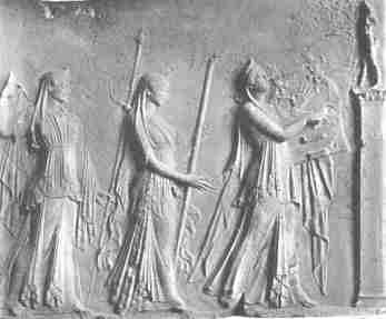 Apollo, Artemis and Leto in procession. Marble relief in the Louvre
